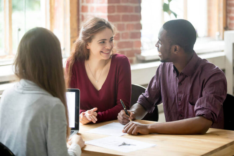 couple signing apartment lease