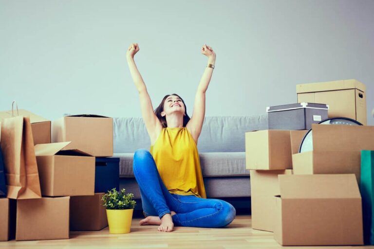 young woman moving into her first apartment