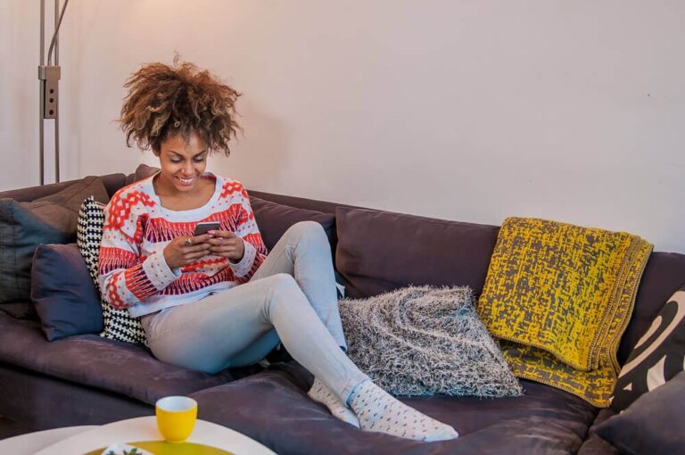 woman using rental app on her phone