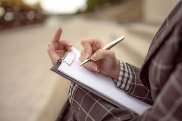 woman with clipboard enforcing HOA covenants