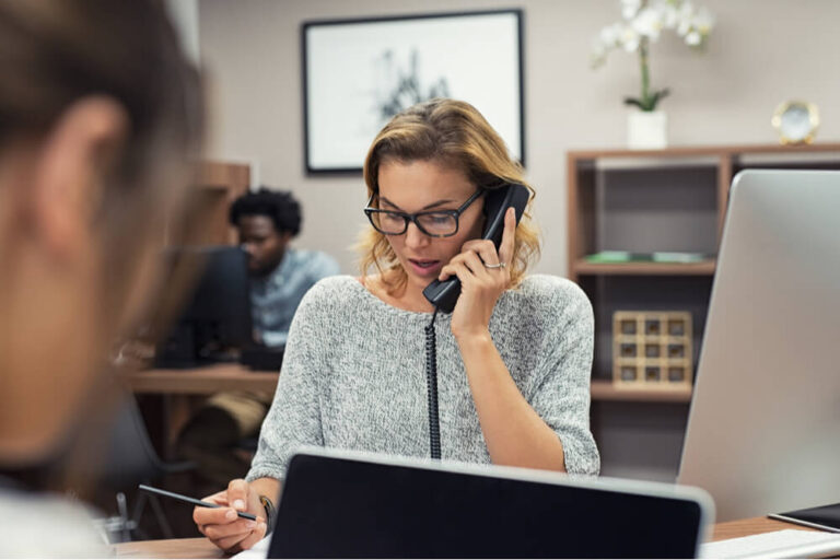 woman in leasing office talking on the phone