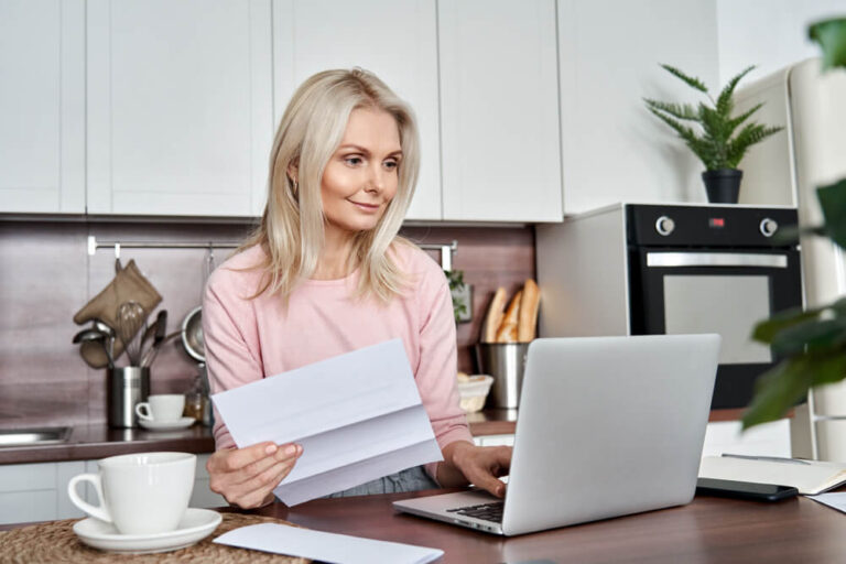 woman assessing the various fees of owning a rental property